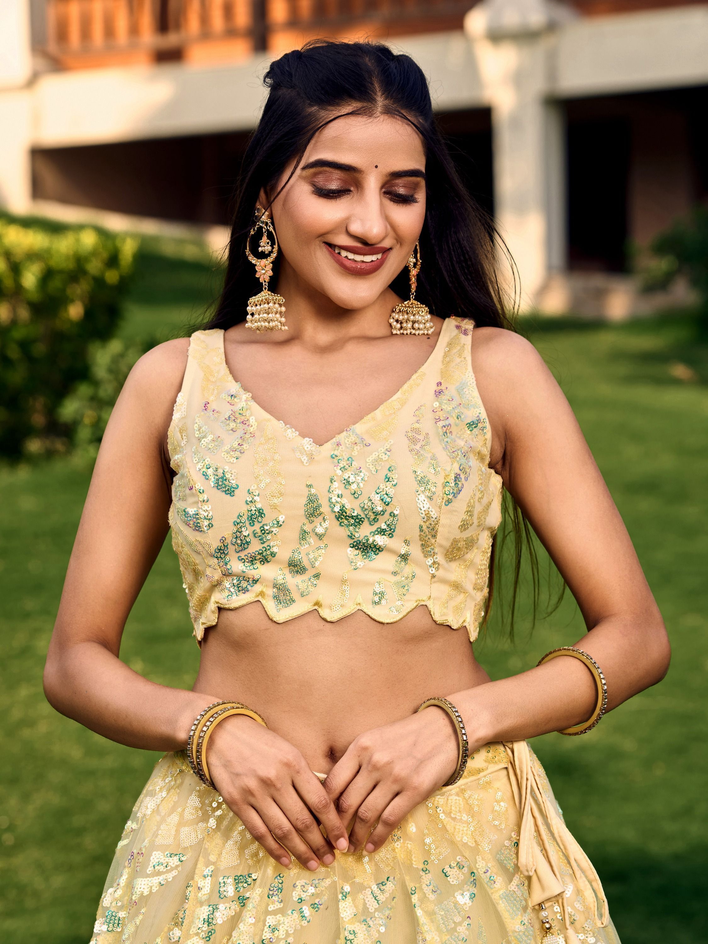 Yellow soft net lehenga choli with heavy multi sequins embroidery and lace border dupatta perfect for weddings receptions and glam parties